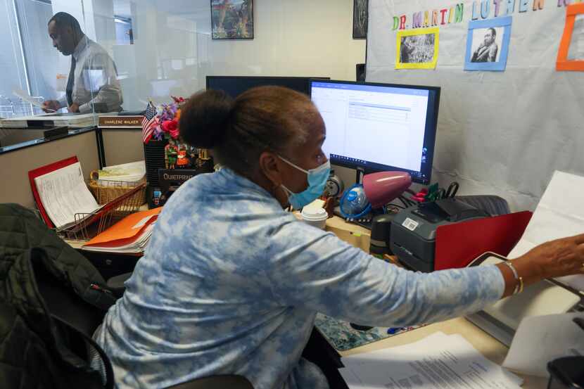 Processing clerk Charlene Walker scans court documents into the Tyler Technologies' Odyssey...
