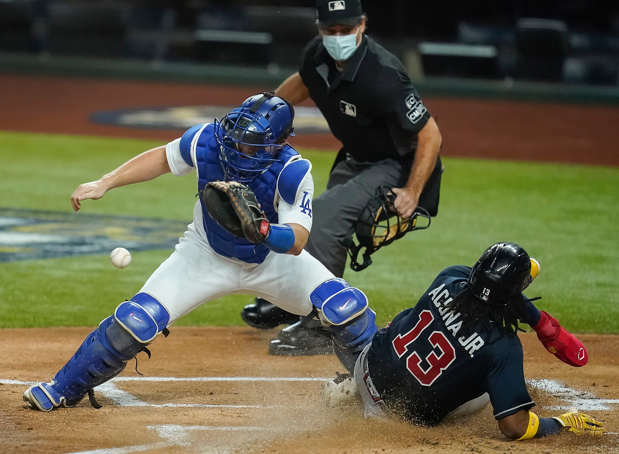 Atlanta Braves right fielder Ronald Acuna Jr. (13) scores on a single by designated hitter...