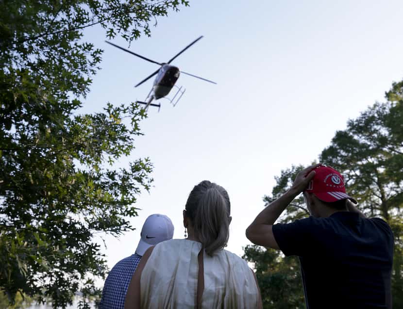 A helicopter lands to pick up some guests at Shannon Wynne's Caddo Lake house.
