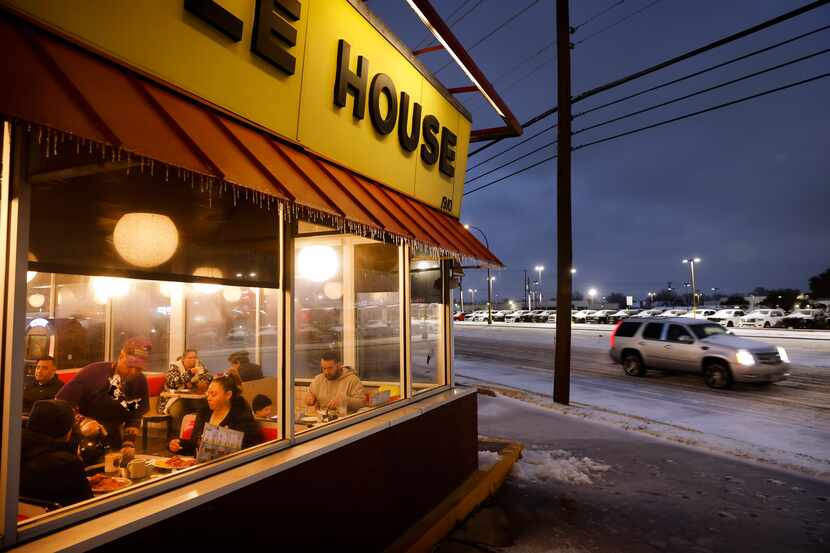 Jimmie Sloan pours a hot cup of coffee for diners keeping warm inside a Waffle House on N....