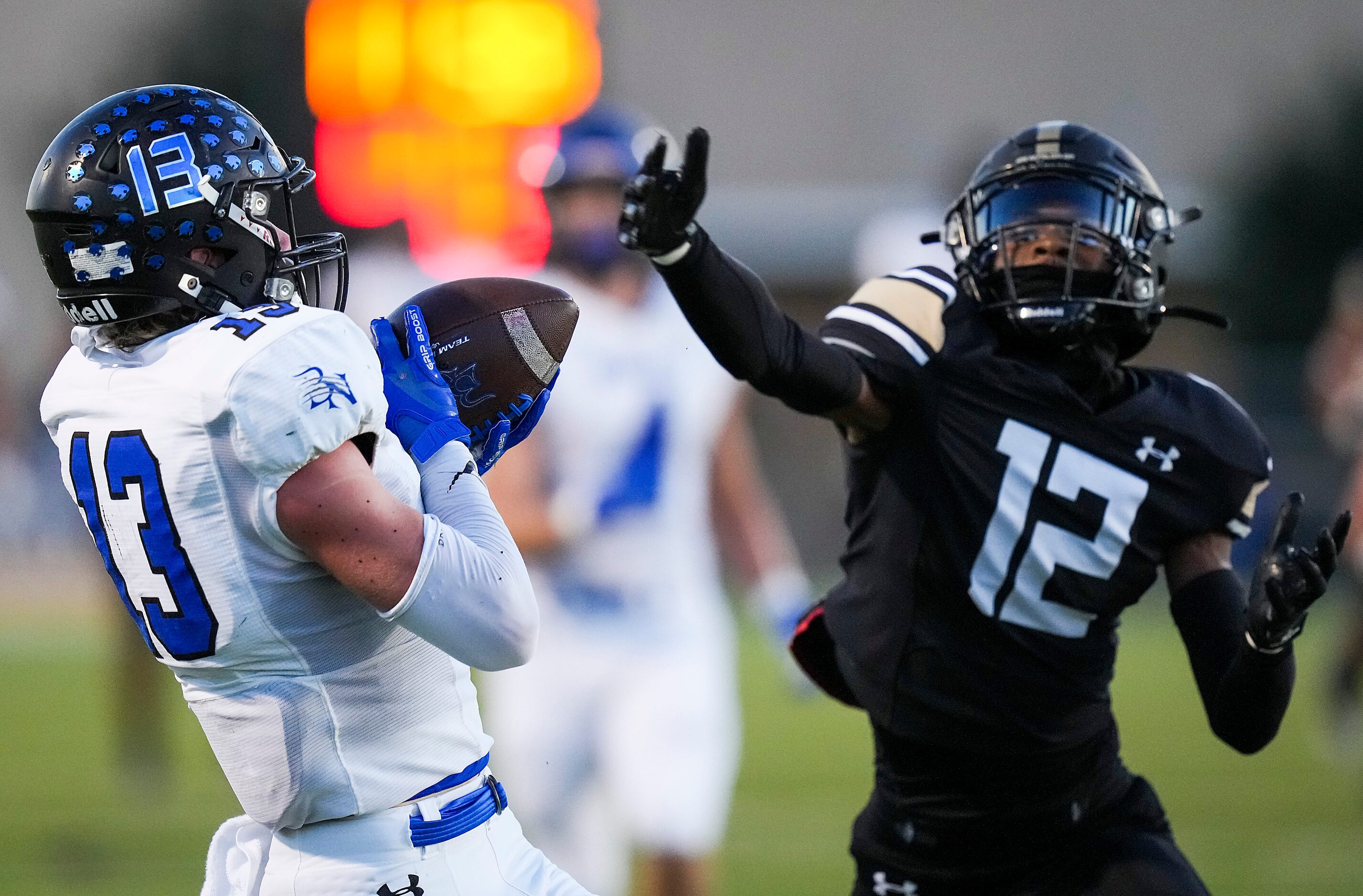 Trophy Club Byron Nelson wide receiver Gavin McCurley (13) hauls in a long pass as Keller...