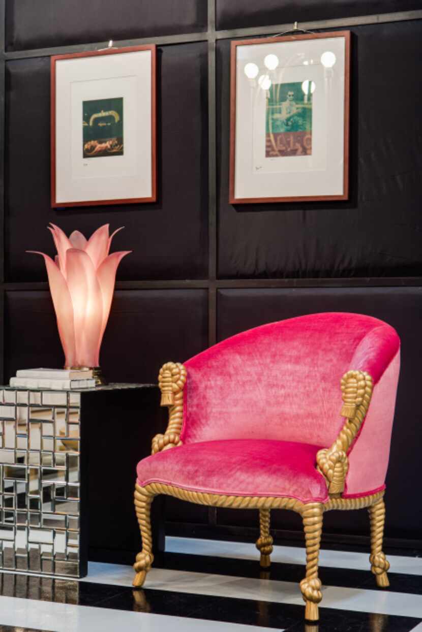 A pair of pink-upholstered armchairs, with gold rope-and-tassel motif, are from the ’70s....