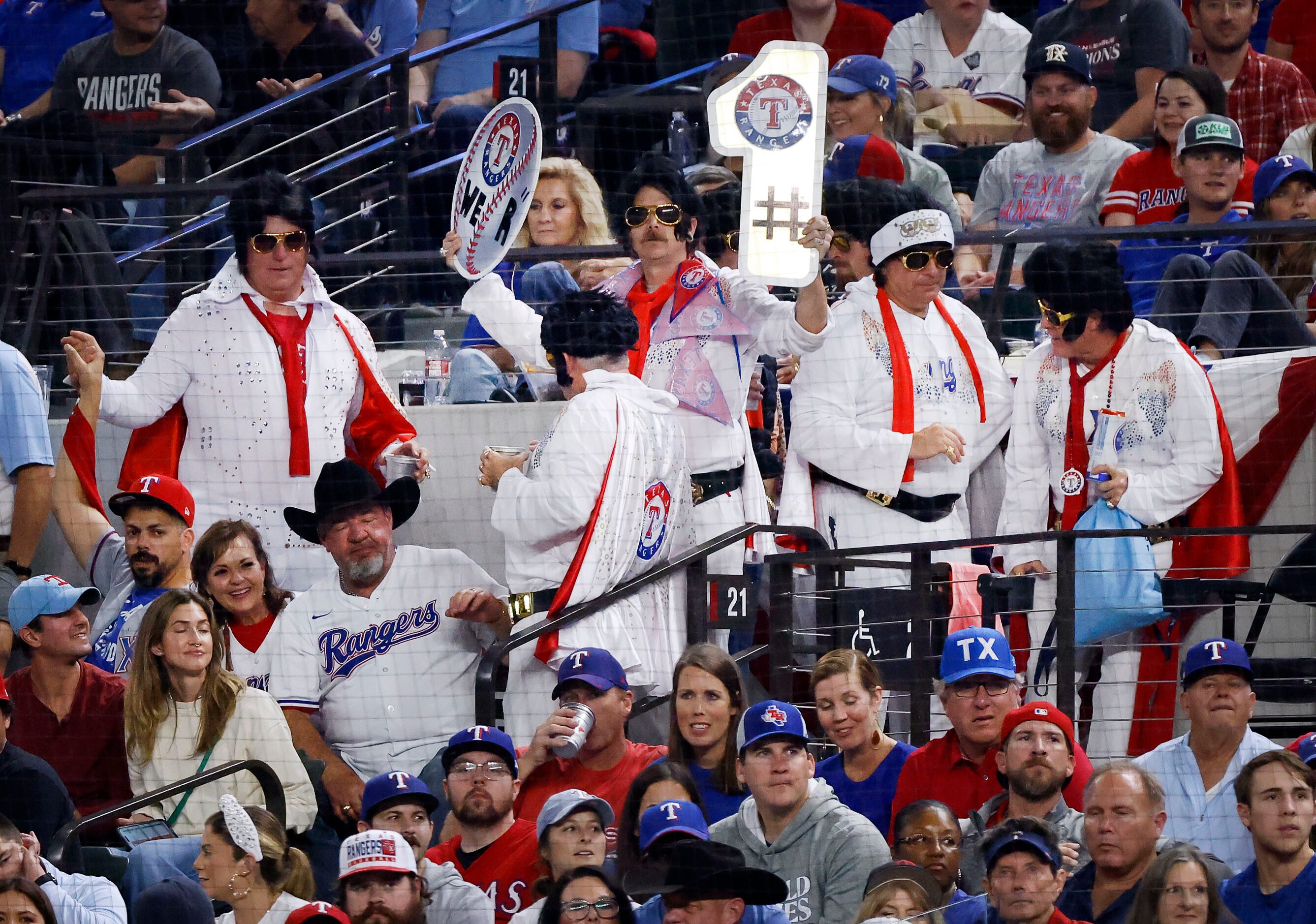 A group of Elias impersonators visit with fans in the stands during Game 2 of the World...