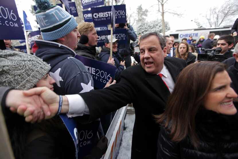 New Jersey Gov. Chris Christie meets supporters outside Webster Elementary School in...