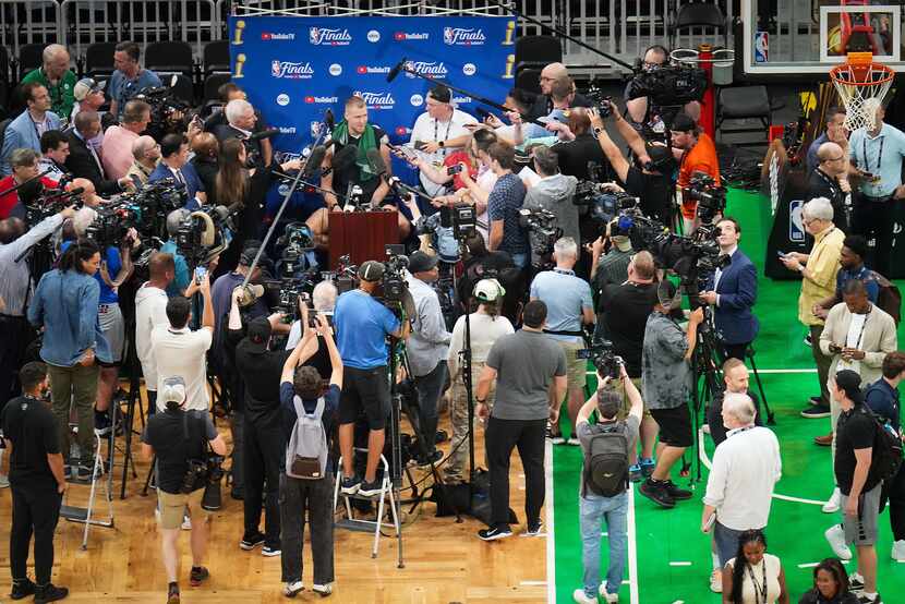 Boston Celtics center Kristaps Porzingis addresses reporters during media day in preparation...