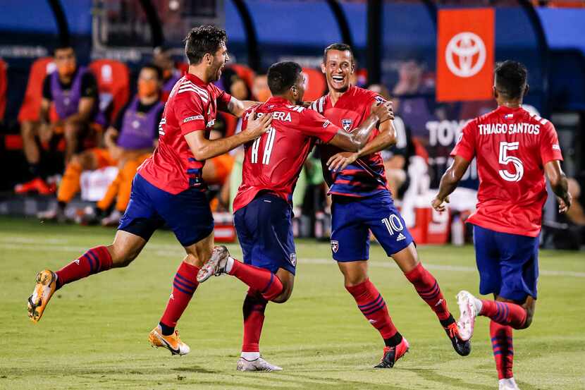FC Dallas midfielder Andrés Ricaurte  (10) is congratulated by teammates after scoring a...