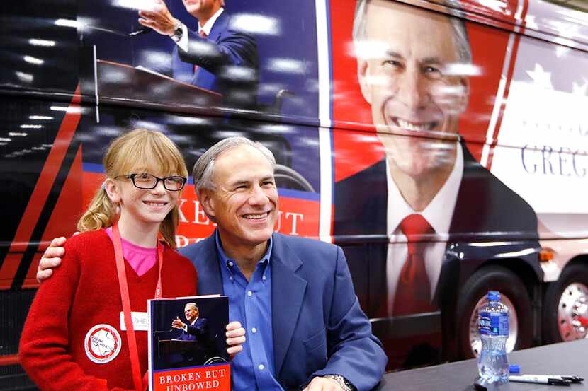  Jessie Roussel, 11, of Needville posed with Gov. Greg Abbott during the 2016 Texas...
