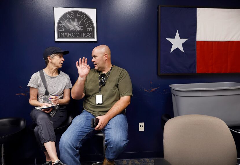 Reporter Sharon Grigsby interviews Dallas police Maj. Devon Palk following a narcotics raid...