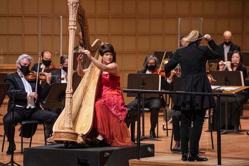 Harpist Emily Levin  and conductor Gemma New (right) perform Ginastera's Harp Concerto with...