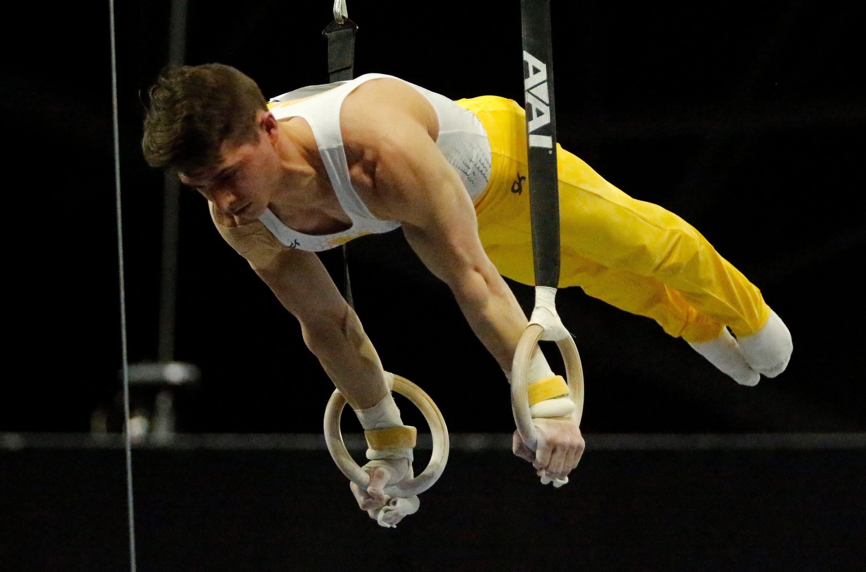 Paul Juda of the University of Michigan performs on the rings during the mens finals at the...