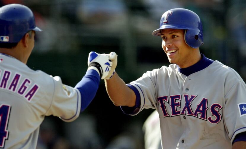 ORG XMIT: S0354635863_WIRE Texas Rangers' Alex Rodriguez, right, is congratulated by...