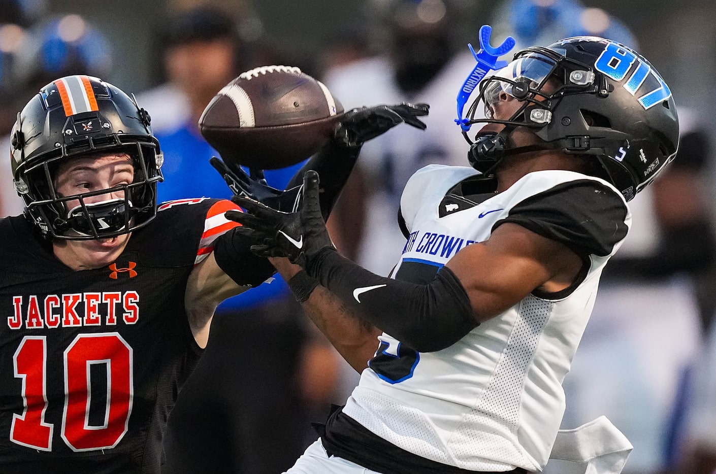 North Crowley running back Daniel Bray (5) hauls in a long pass as Rockwall defensive back...