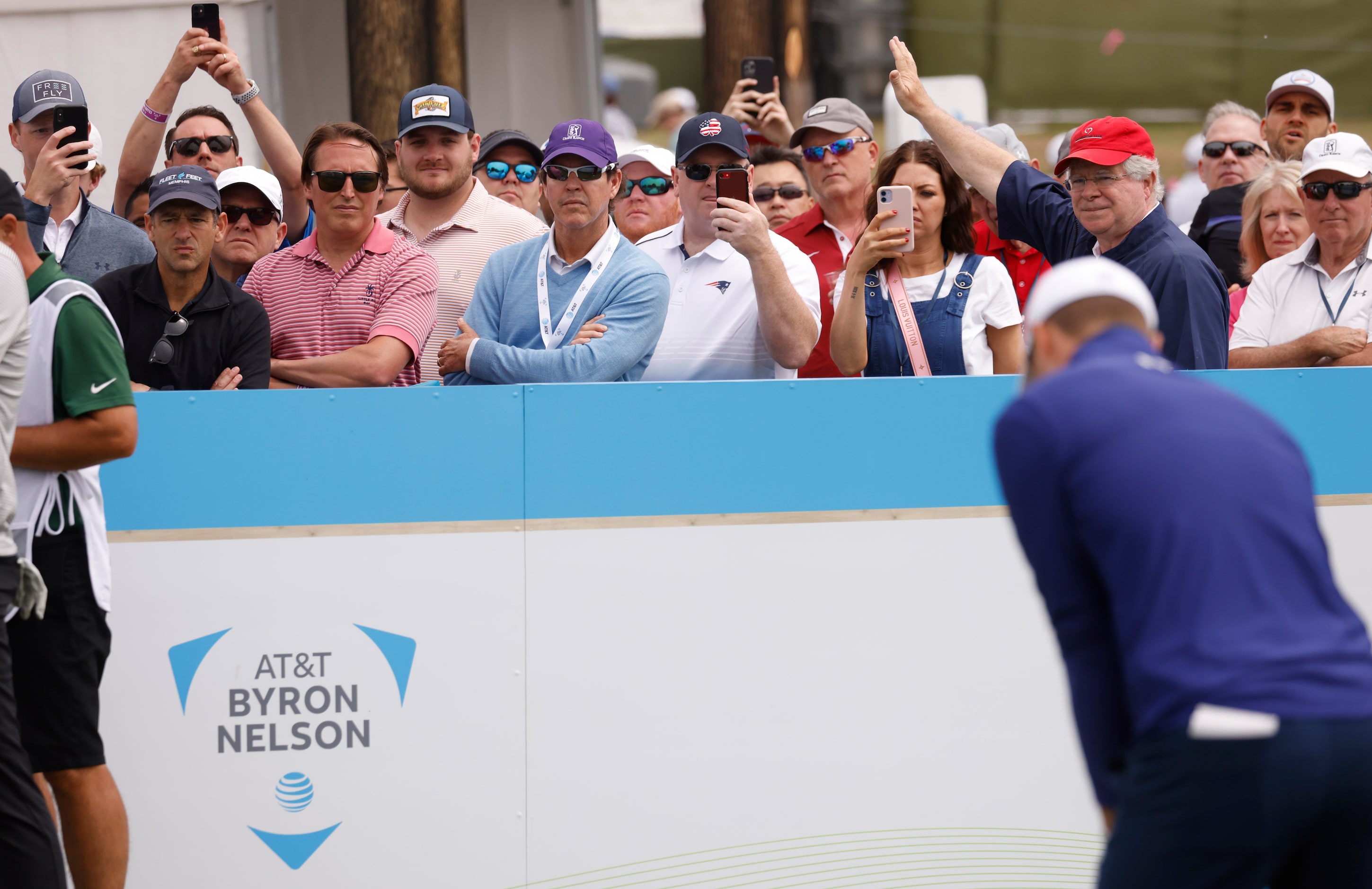 Fans record Jordan Spieth as he prepares to tee off of the 7th hole during round 2 of the...