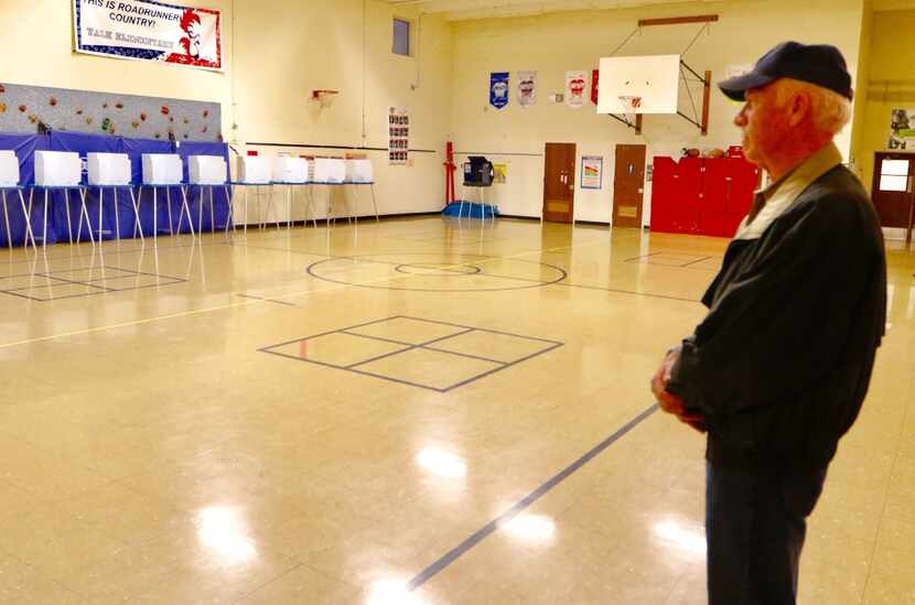 John Healy was the first person in line to vote at Yale Elementary School in Richardson on...