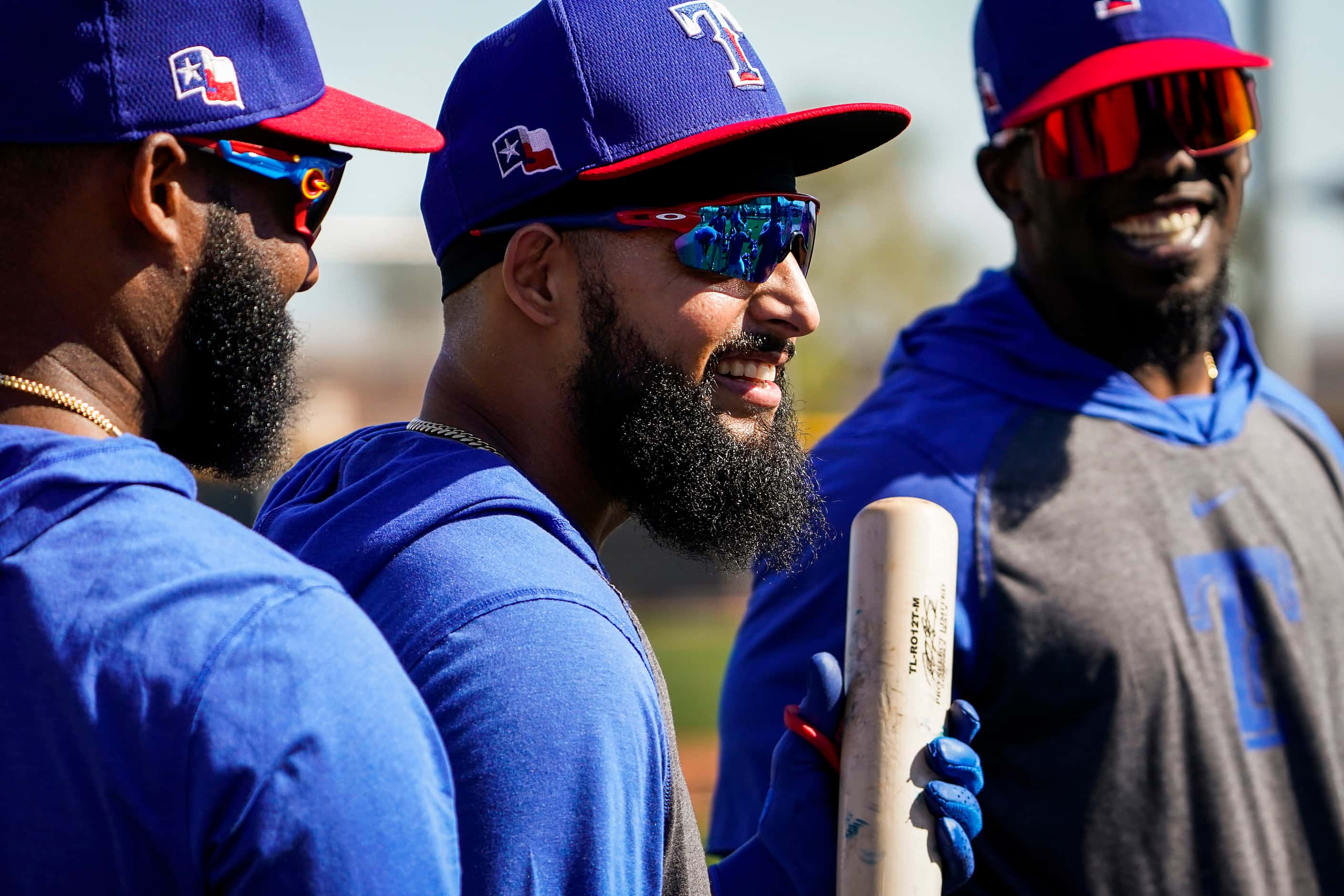 Texas Rangers second baseman Rougned Odor (center) laughs with Danny Santana (left) and...