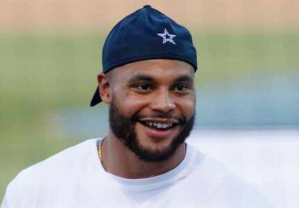 Dak Prescott smiles during the annual Reliant Home Run Derby featuring Cowboys players and...