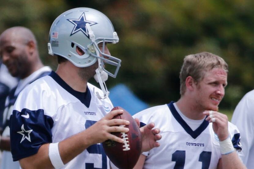 Dallas quarterback Tony Romo (9) and receiver Cole Beasley (11) are pictured during the...