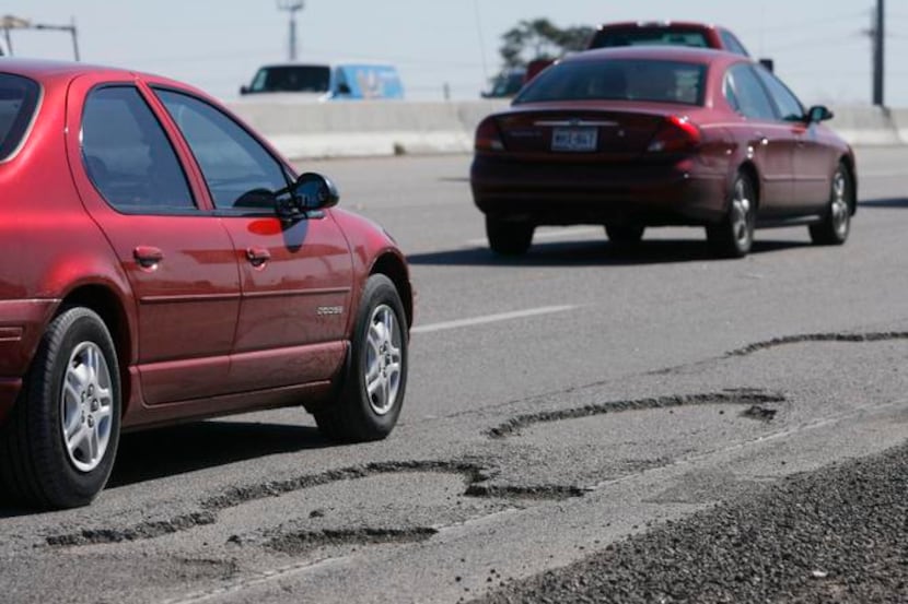Potholes shown on a freeway in Dallas.