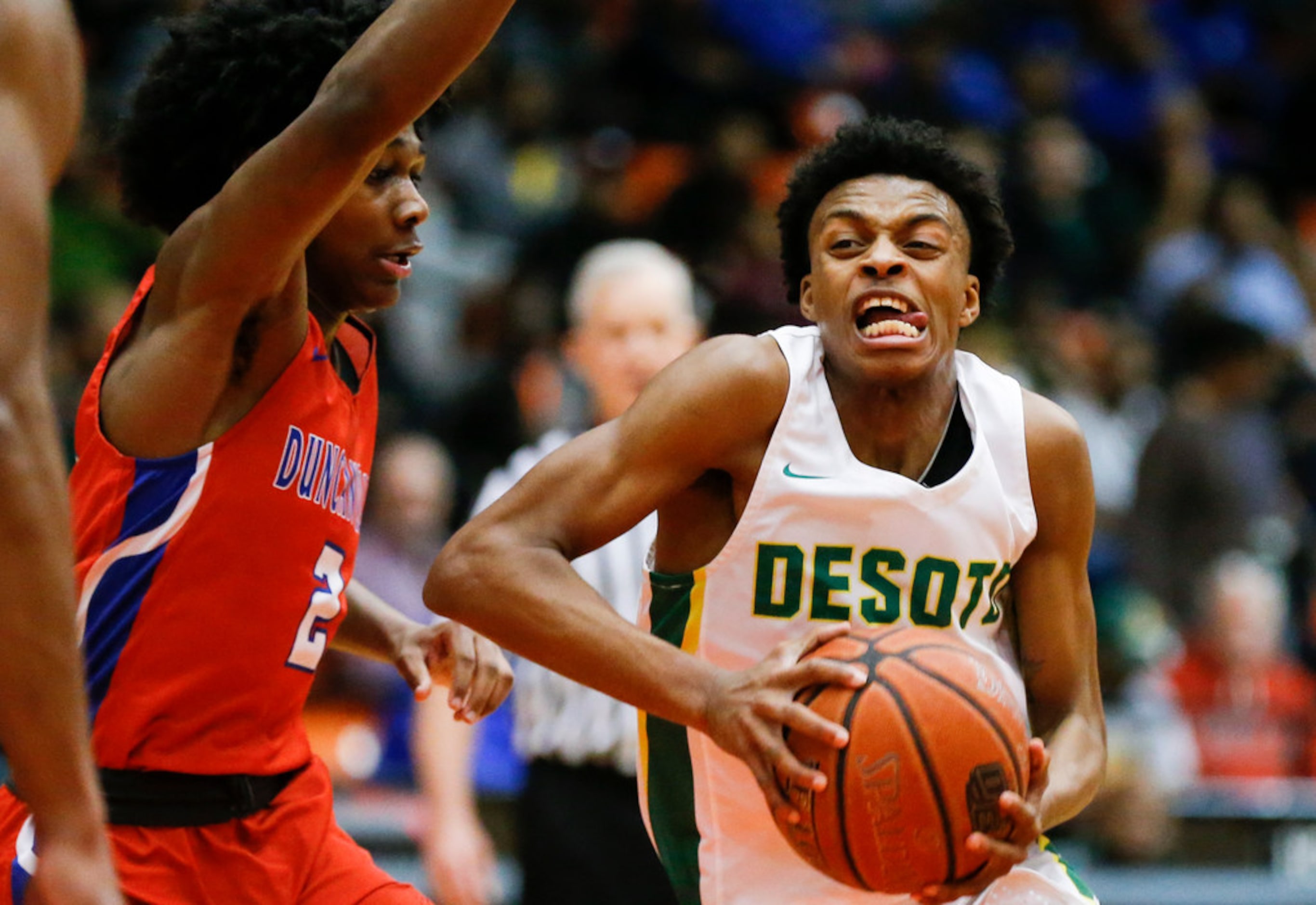 DeSoto senior guard Chris Pryor, right, battles Duncanville junior guard Ja'Bryant Hill (2)...