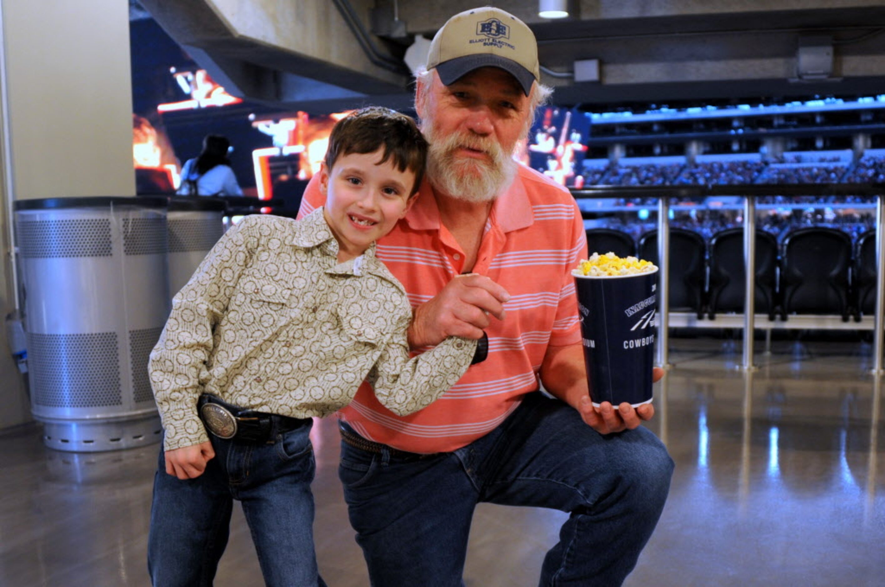 Rick Dunham and grandson Avery Simmons, 6, from Midlothian grabbed a snack before the main...