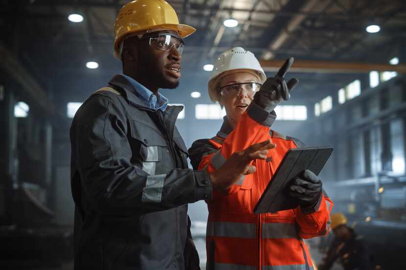 Two engineers working at a construction site.