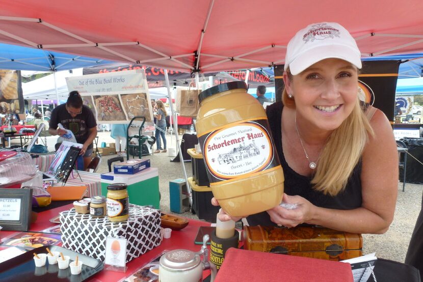 Lee Anne Schorlemer Sugg mugs with her family's sweet-hot Schorlemer mustard. 