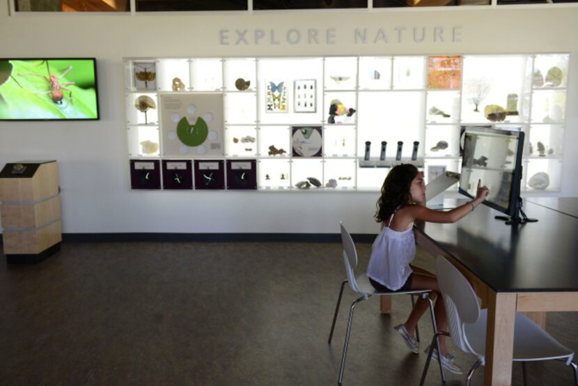 Mariana Hernandez, 8, plays on the interactive computer at the Rory Meyers Children's...