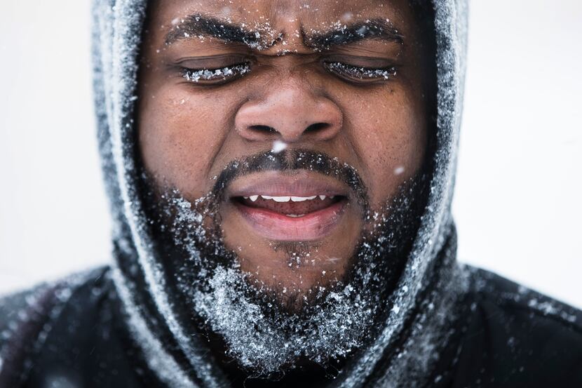 ATLANTIC CITY, NJ: Ajamu Gumbs of New York makes his way to a bus station during a winter...