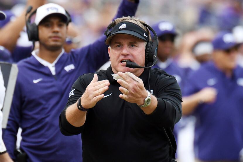 TCU coach Gary Patterson, calls for a timeout late in the second quarter of an NCAA college...