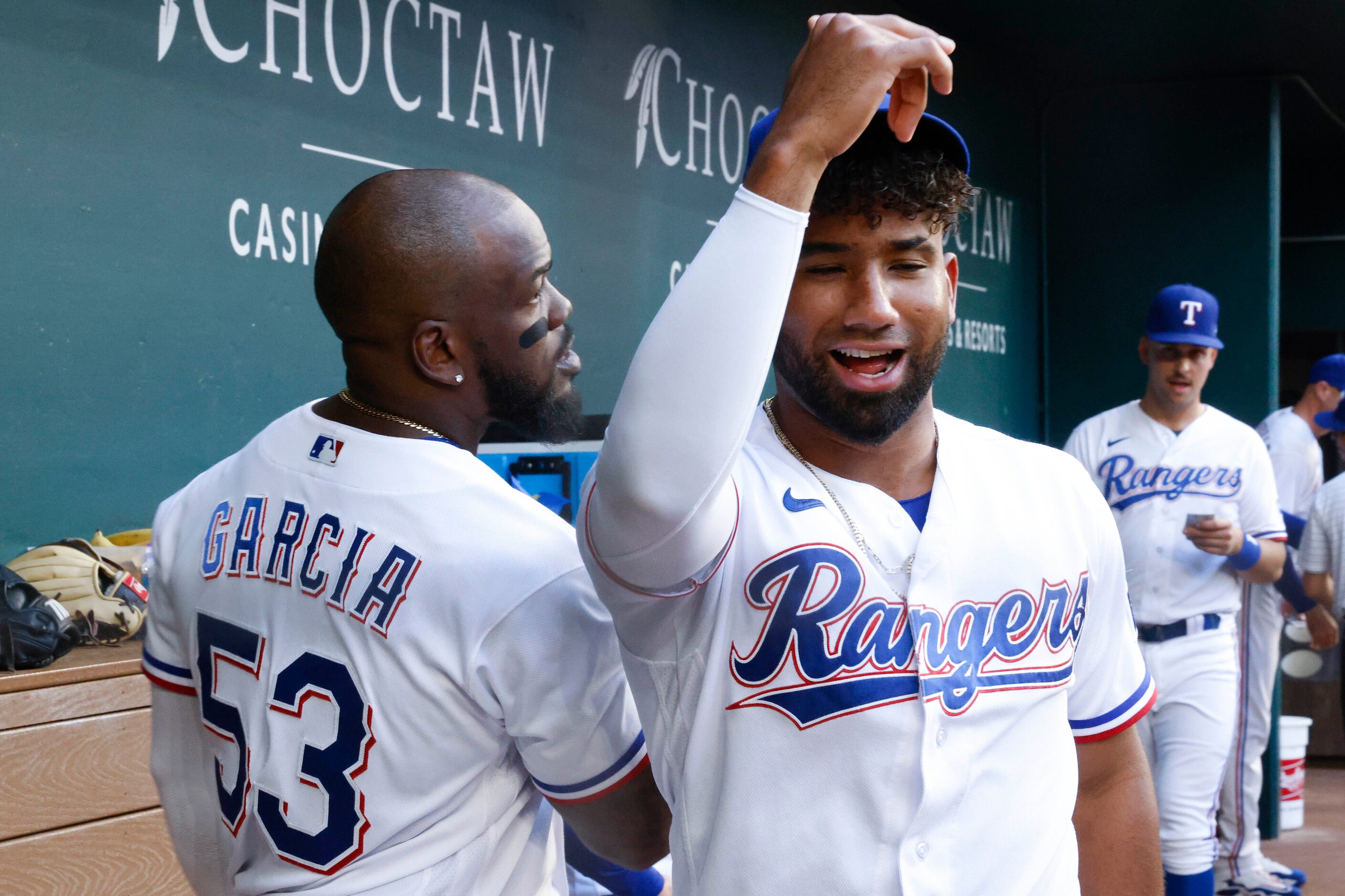 Texas Rangers right fielder Adolis Garcia (left) and Texas Rangers third baseman Ezequiel...