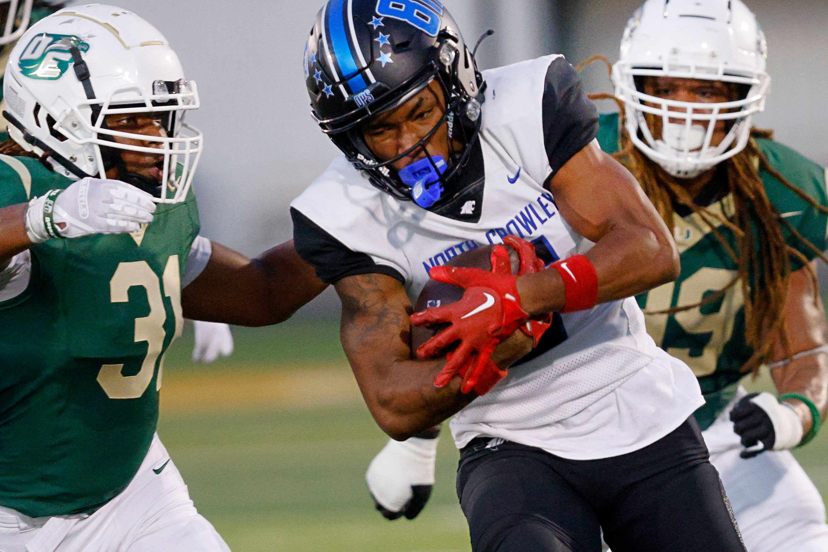 North Crowley's Daniel Bray (5) keeps the ball away from DeSoto's Jackson Curry (31) and...