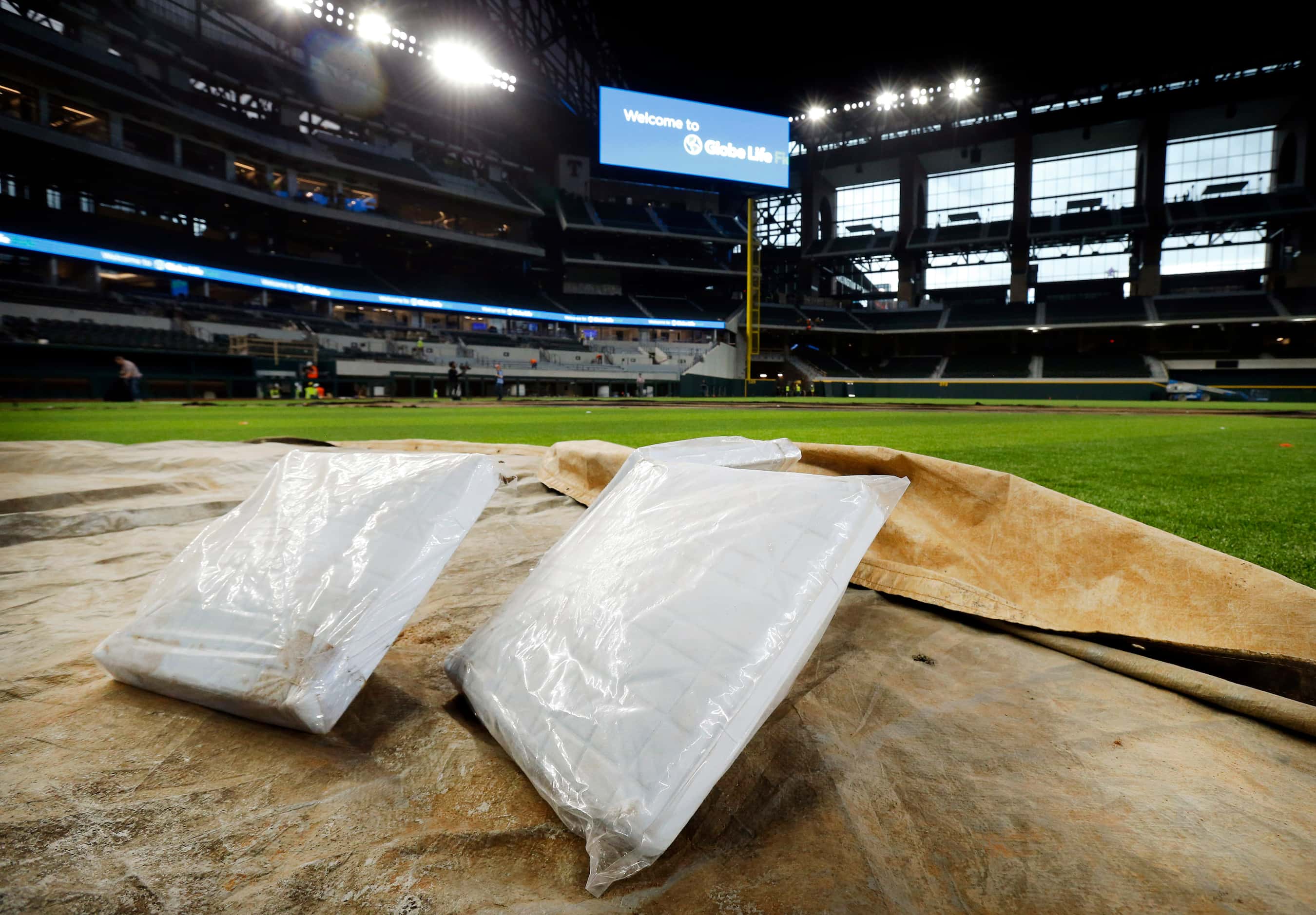 Bases are waiting to be installed in the new Globe Life Field under construction in...