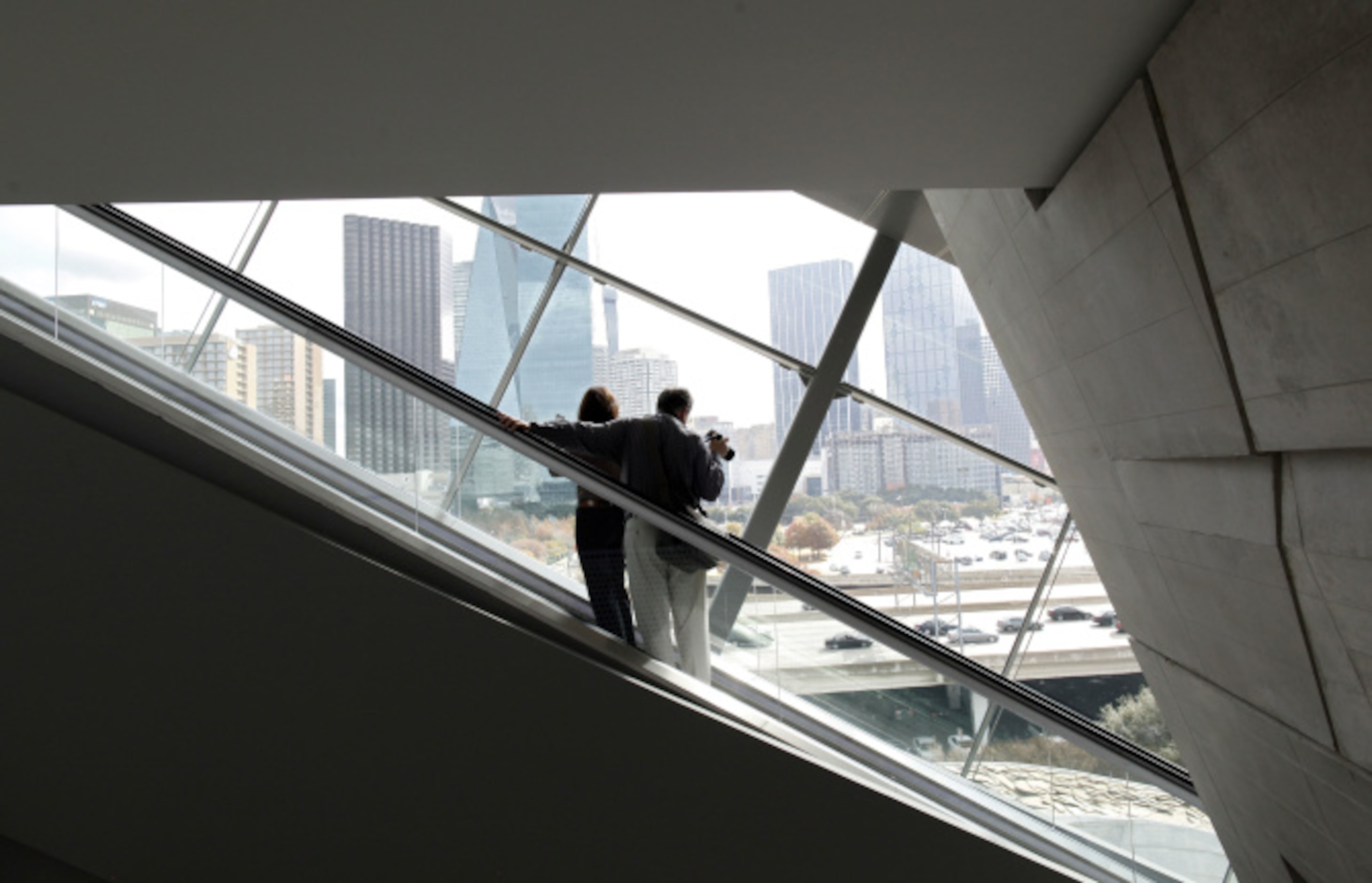 A couple enjoys the view as they ride the escalator to the top during the opening of the...