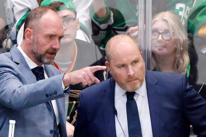 Dallas Stars head coach Pete DeBoer (left) confers with assistant Steve Spott during the...
