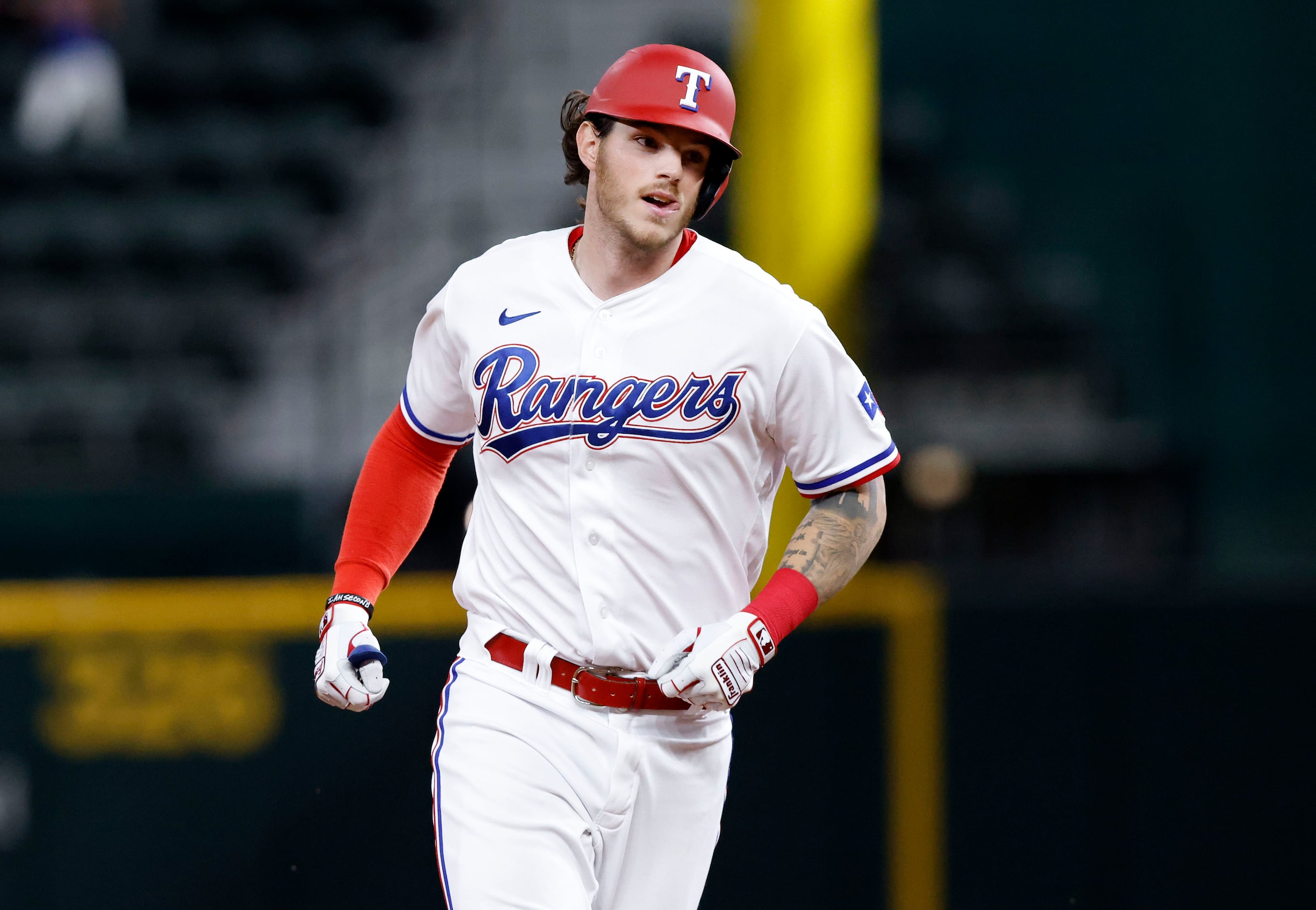Texas Rangers Jonah Heim (28) rounds the bases after hitting his first Major League home run...