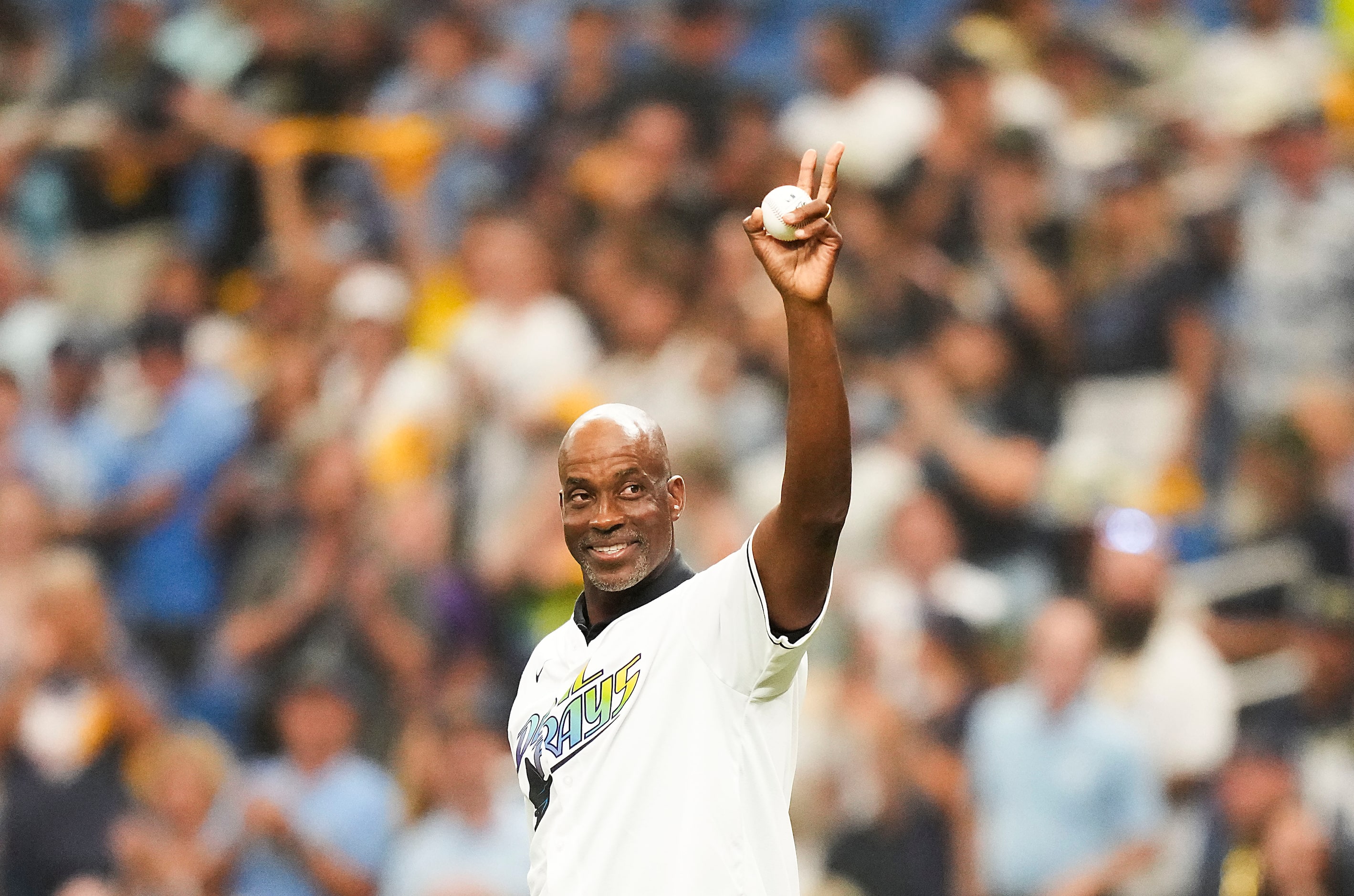 Fred McGriff takes the field to throw a ceremonial first pitch before an  American League...