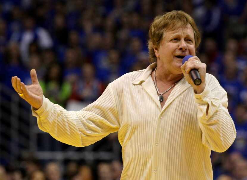 In this Jan. 25, 2010 file photo, Eddie Money sings the national anthem before an NCAA...