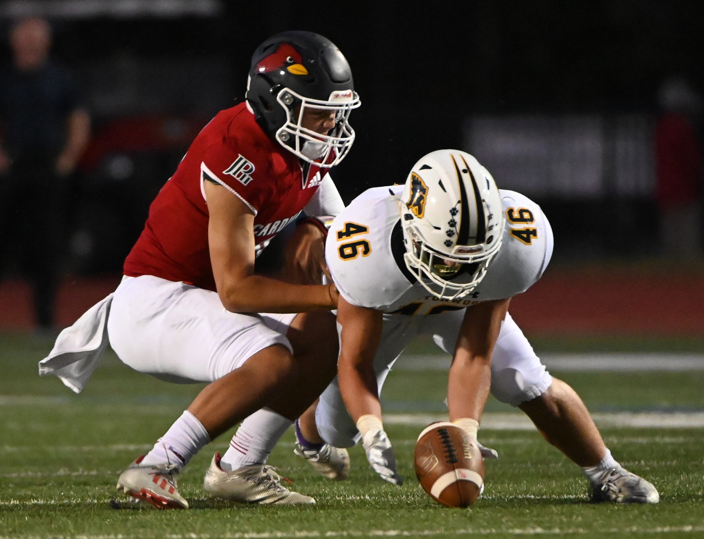 Prestonwood's Hudson Lunsford (46) recovers a fumble in front of John Paul II’s Jacob...