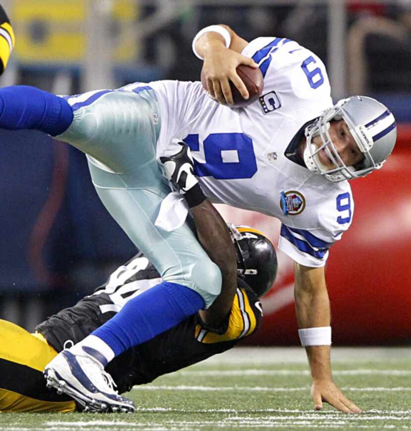 Dallas Cowboys quarterback Tony Romo (9) is sacked by Pittsburgh Steelers inside linebacker...