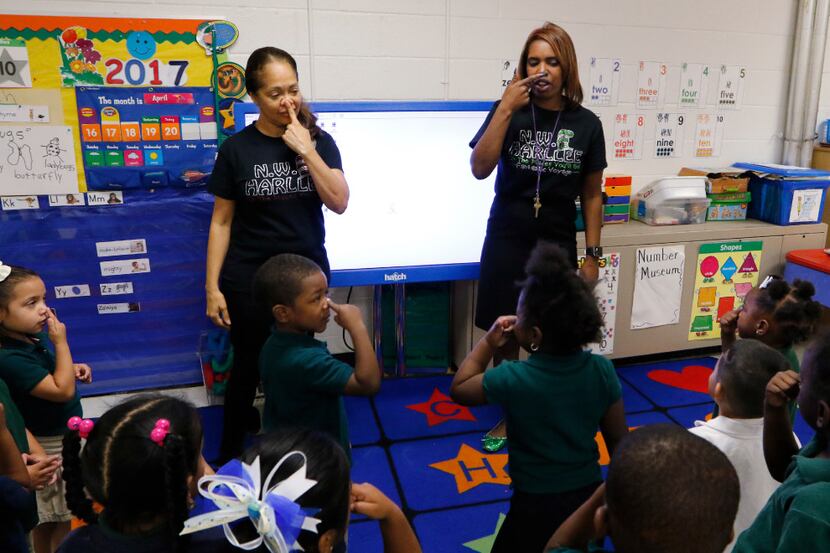 Onjaleke Brown, principal at N.W. Harllee Early Childhood Center in Dallas (right)...