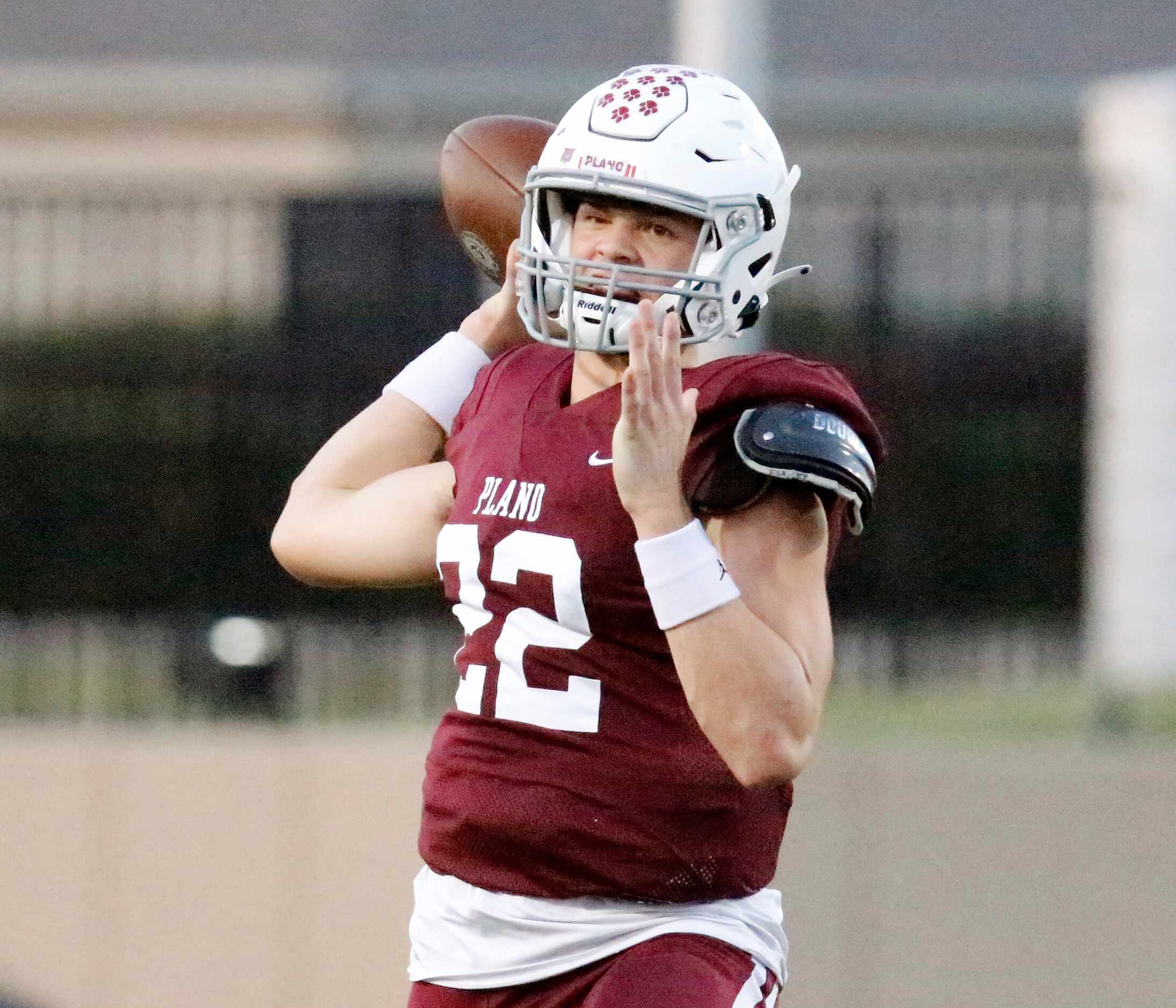Plano Senior High School quarterback Drew Forkner (22) throws a pass during the first half...