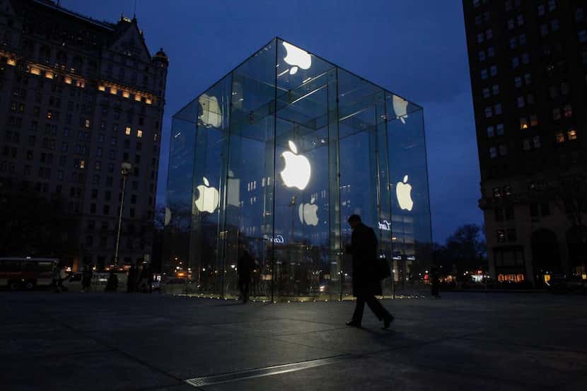 
A man walks outside the Apple store on the Fifth Avenue in New York Wednesday. Apple's...