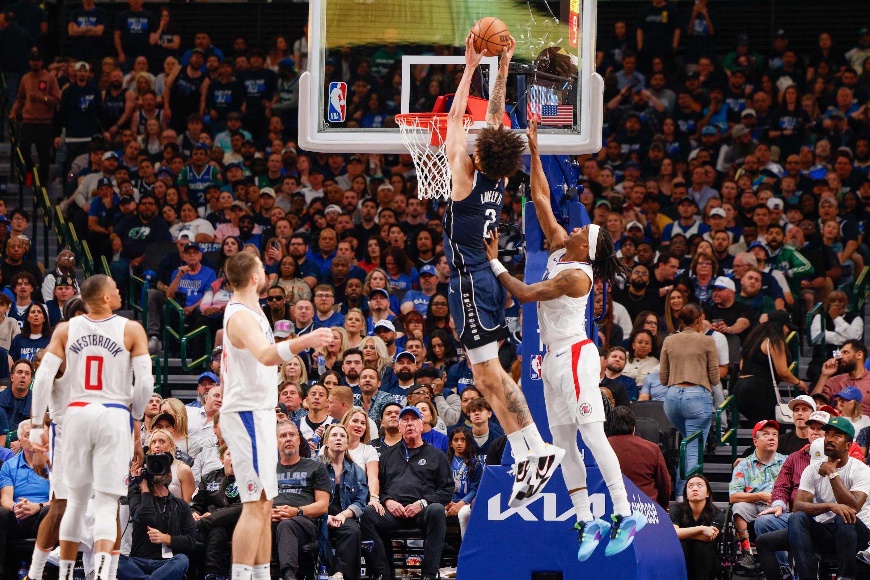 Dallas Mavericks center Dereck Lively II (2) finishes an alley-oop from Dallas Mavericks...