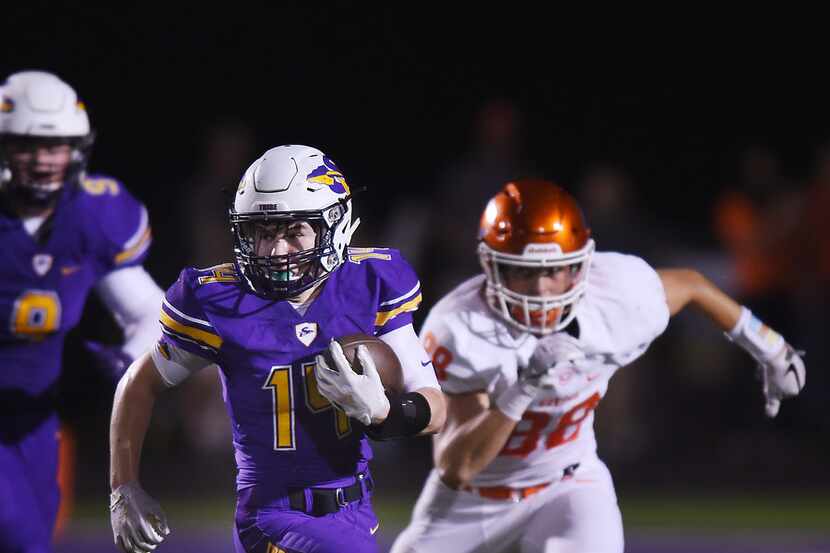 Sanger running back Colby Lewis (14) gains yardage against Celina in the first half of their...