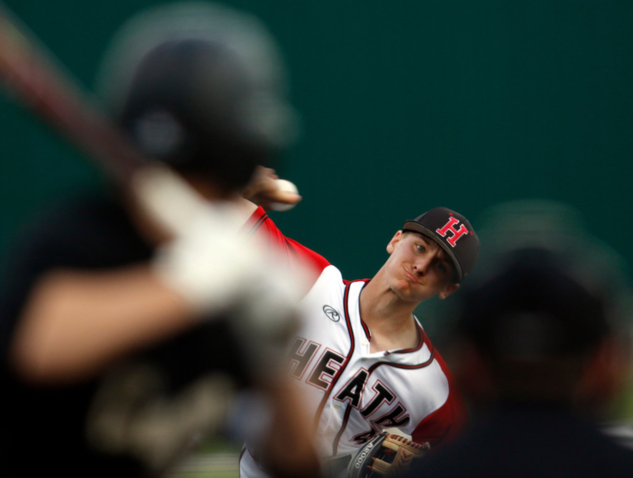 Rockwall Heath pitcher Jett Williams (4) delivers a pitch during the first binning of play...