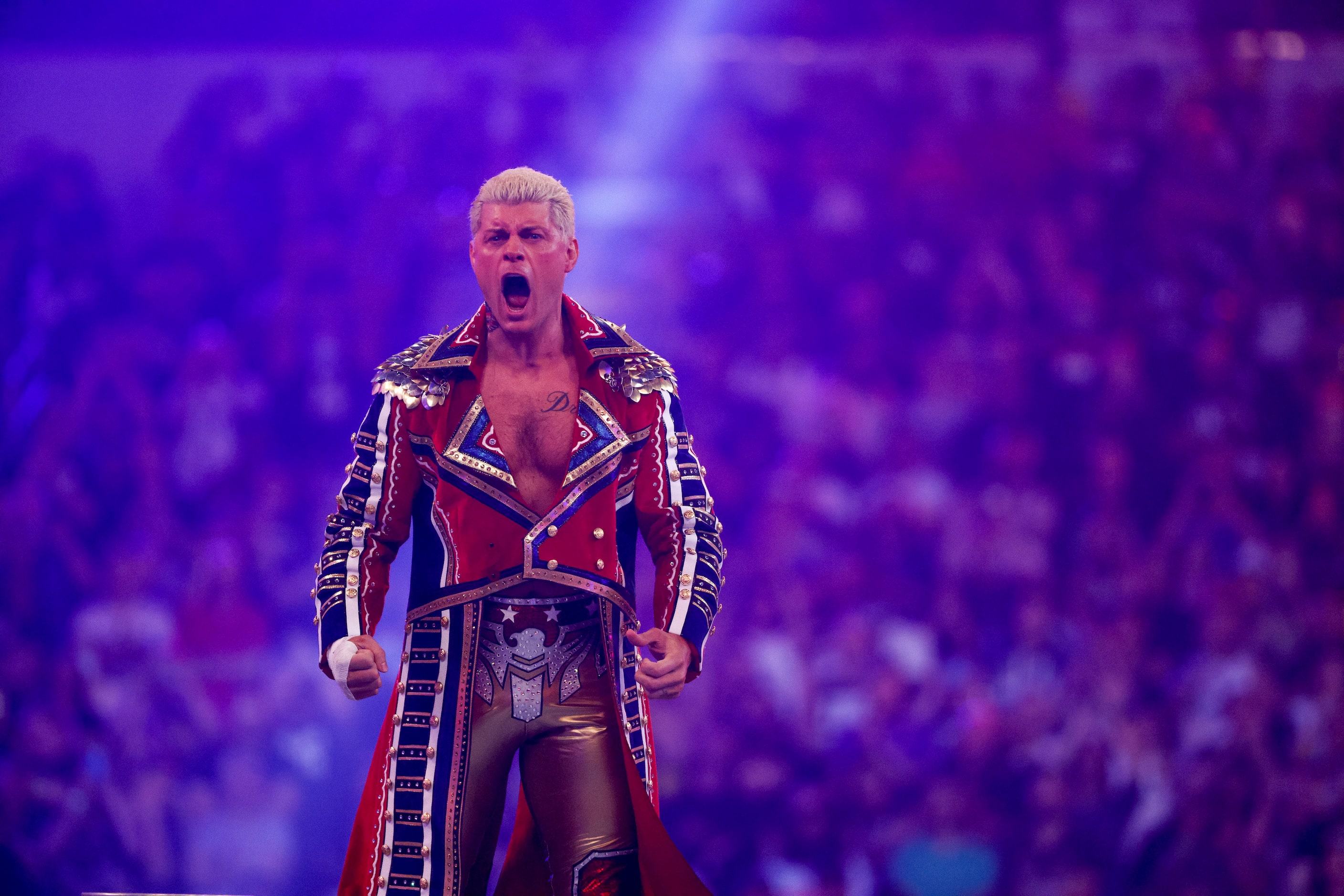 Cody Rhodes enters the ring before a match against Seth Rollins at WrestleMania 38 at AT&T...