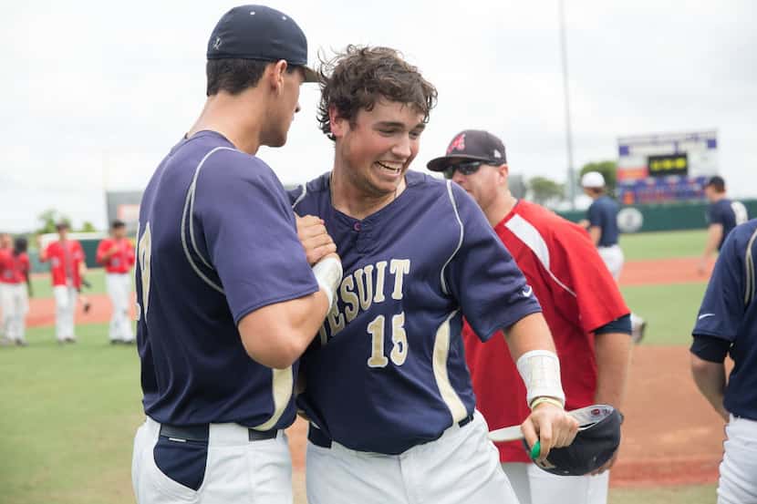 Jesuit seniors Connor Lynch, right, and Kyle Muller, left, celebrate their 9-1 win over...