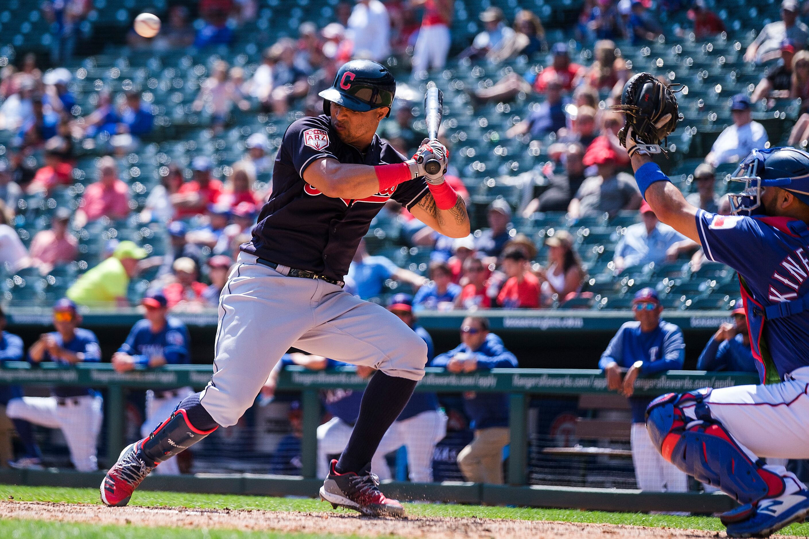 Cleveland Indians center fielder Leonys Martin gets out of the way of a pitch from Texas...