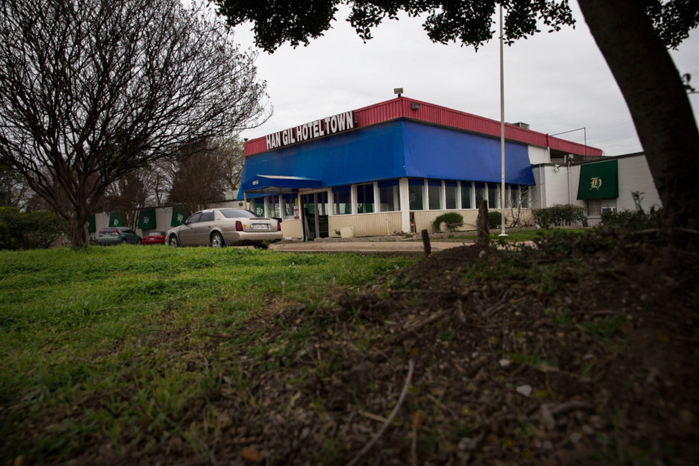 Vehicles parked in front of the Han Gil Hotel Town in the 11300 block of Dennis Road in...