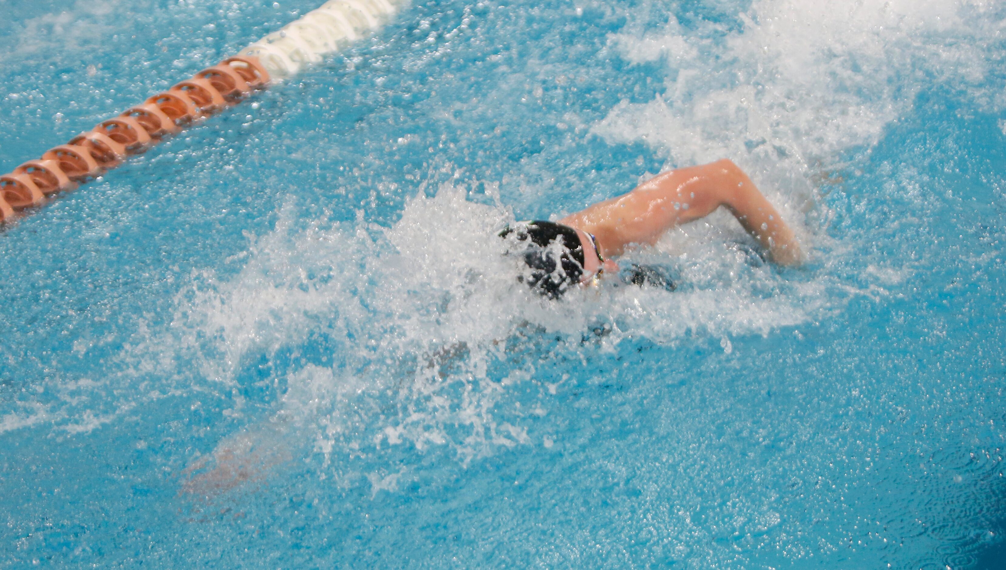 Southlake Carroll swimmer Hailey Heldenbrand swims to victory in her heat in the 6A Girls 50...